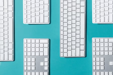 silver-and-white-keyboards-flat-lay