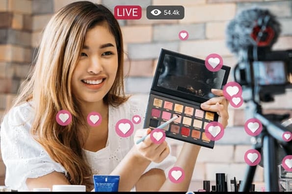 An influencer launches a live-video marketing campaign on social media where she gets engagement by showing eye shadow shades from a brand.