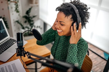 woman recording a podcast