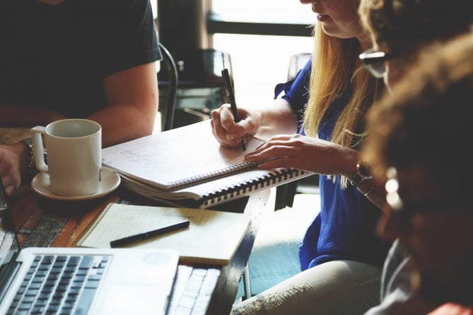 Freerange stock image of a person taking notes