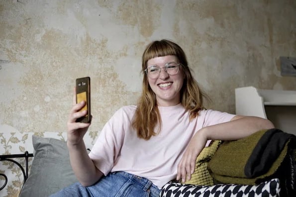 woman on phone reading about tiktok myths