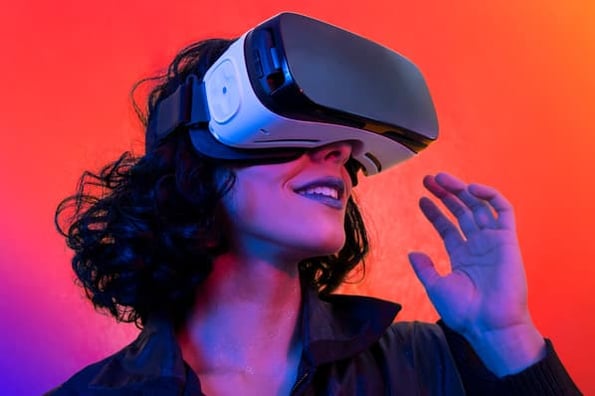 a female consumer steps into the metaverse using a VR headset