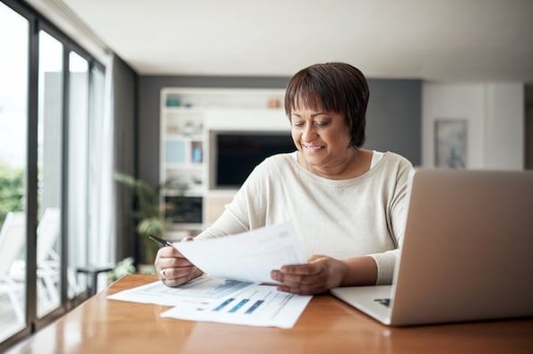 Woman checking bank statement for an ACH credit
