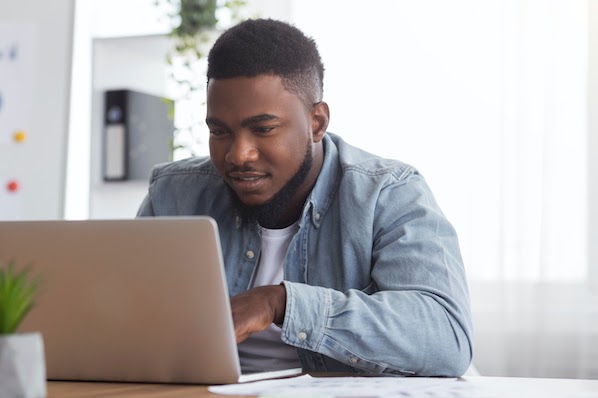man using a laptop to check wordpress version