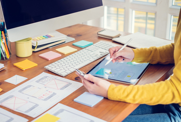 woman choosing elements to include in her company's website