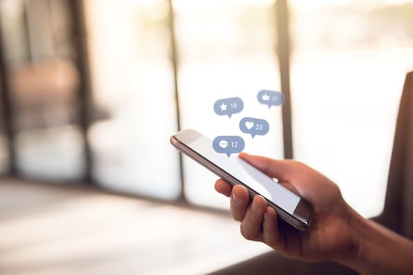 sales rep uses mobile social media apps to connect with prospects