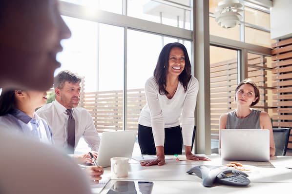 leader speaks with her team during meeting